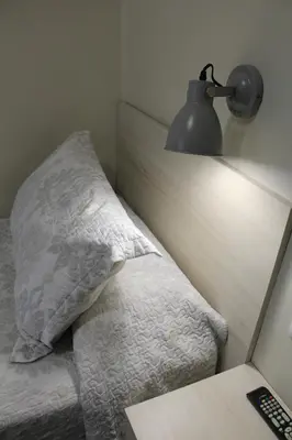 two beds in a hotel room with two bedsvisor at Hostal La Romànica in Sabadell