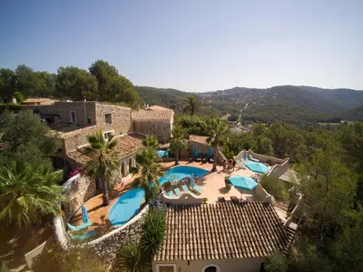 an aerial view of a resort with a swimming pool at Casa Los Arcos at Masia Nur Sitges, Adults only in Canyelles