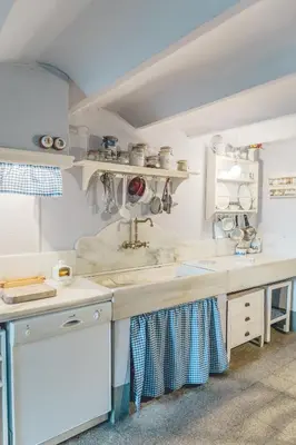 a kitchen with a sink and a counter at Casa Baulenas in Caldes d'Estrac