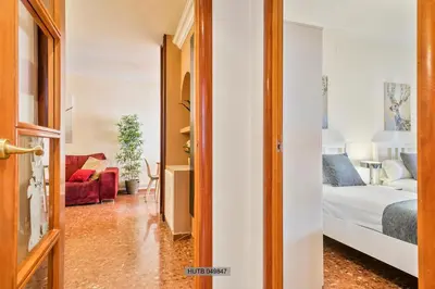 a bedroom with a bed and a living room at Alcam Barbera Centro in Barbera del Valles