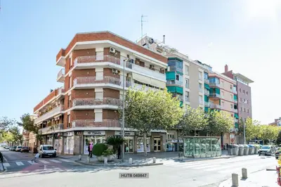 a tall building on a city street with a street at Alcam Barbera Centro in Barbera del Valles