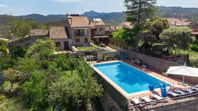 a villa with a swimming pool and a house at 21 Sleeps Private Pool Villa & BBQ Near Barcelona in Rocafort