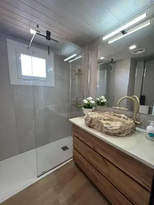 a bathroom with a shower and a sink at APARTAMENTO MARINERO, Vistas impresionantes. in Sitges