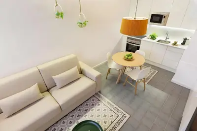 a living room with a couch and a table at Ola Living Calabria in Barcelona