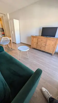 a living room with a couch and a tv at Arena Gold Euroviajeros apartaments in Pineda de Mar
