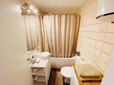 a bathroom with a sink and a toilet and a shower at Arena Gold Euroviajeros apartaments in Pineda de Mar