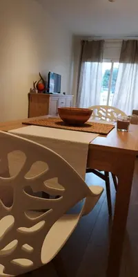 a wooden table with a bowl on top of it at Arena Gold Euroviajeros apartaments in Pineda de Mar