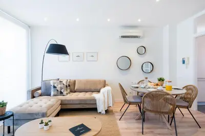 a living room with a couch and a table at Petit Luxe Tobella Esquerra in Terrassa