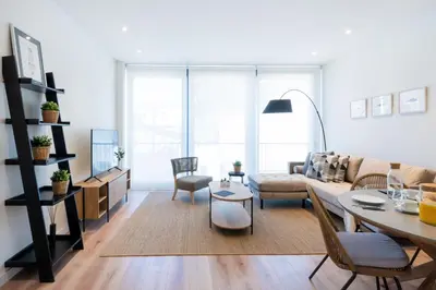 a living room with a couch and a table at Petit Luxe Tobella Esquerra in Terrassa