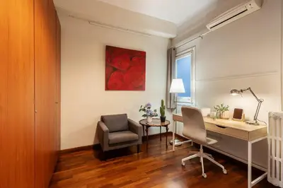a home office with a desk and a chair at Large & beautiful apartment 4min from Passeig de Gràcia in Barcelona