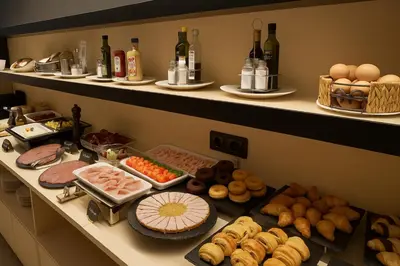 a buffet with many different types of food and drinks at Petit Palace Trencadís in Barcelona