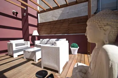 a rendering of a living room with a statue at Home to Home Barcelona in Barcelona