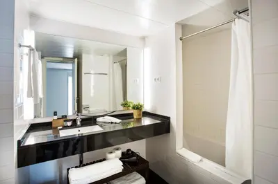 a bathroom with a sink and a mirror at Durlet Beach Apartments in Barcelona