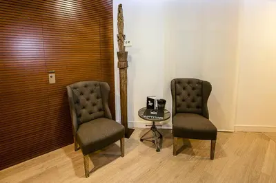 two chairs and a table in a room at The 8 Boutique B&B in Barcelona