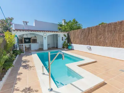a swimming pool in the backyard of a house at Holiday Home Remedios by Interhome in Cunit