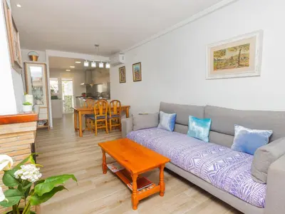a living room with a couch and a table at Holiday Home Remedios by Interhome in Cunit