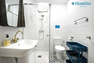 a bathroom with a shower and a sink and a toilet at Hotelito Boutique Badalona Mar in Badalona