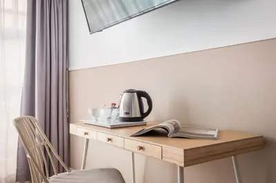 a table with a coffee maker and a book on it at BYPILLOW House in Barcelona
