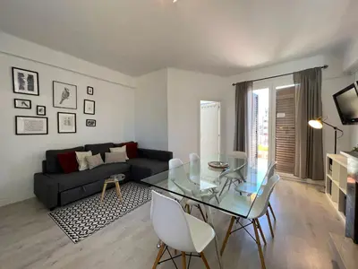 a living room with a glass table and a couch at Stay U-nique Apartments Sèneca in Barcelona