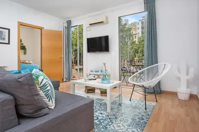 a living room with a couch and a table at Stay U-nique Apartments Sicília in Barcelona