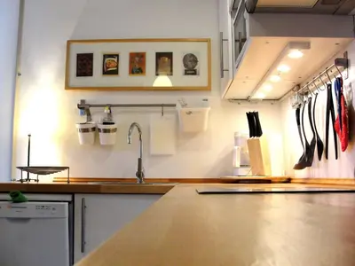 a kitchen with a sink and a counter with utensils at Apartment Eixample Dret Valencia - Cartagena by Interhome in Barcelona
