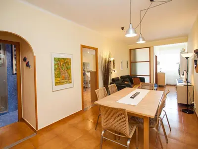 a kitchen and dining room with a table and chairs at Apartment Sardenya - Casp by Interhome in Barcelona