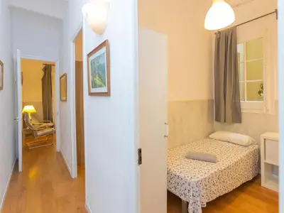 a small bedroom with a bed and a hallway at Apartment Gracia Torrijos by Interhome in Barcelona