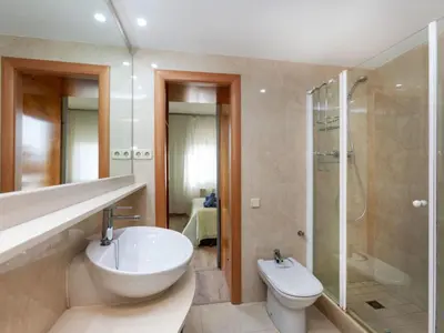 a bathroom with a sink and a toilet and a shower at Apartment Sants-Montjuic Rambla Badal by Interhome in Barcelona
