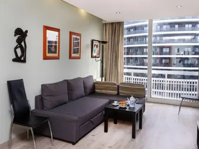a living room with a couch and a table at Apartment Sants-Montjuic Rambla Badal by Interhome in Barcelona
