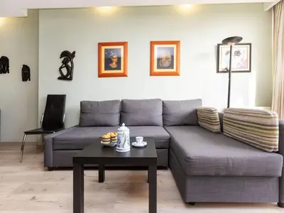 a living room with a couch and a table at Apartment Sants-Montjuic Rambla Badal by Interhome in Barcelona