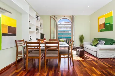 a living room with a table and chairs and a couch at Stay U-nique Apartments Provença II in Barcelona
