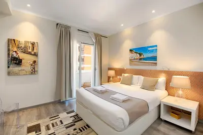a bedroom with a large bed and a window at Eixample Building Apartments by Mercedes Heritage in Barcelona