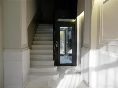 a staircase leading to a door in a building at Barcelona Central Garden Hostal in Barcelona