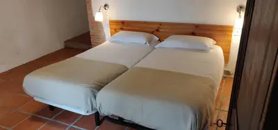 two beds sitting next to each other in a room at Mas Cabrit in Les Franqueses del Vallès