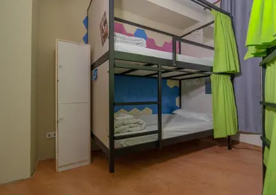 a bunk bed room with two bunk beds and a door at Wow Hostel Barcelona in Barcelona