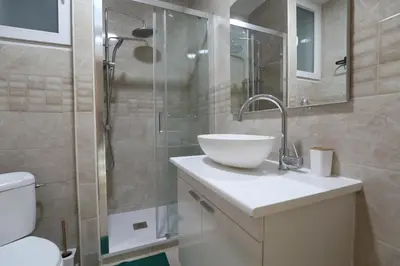 a bathroom with a sink and a shower at Vallparadis apartment in Terrassa