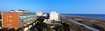 a group of buildings next to the beach at Apartaments Maritim in Castelldefels