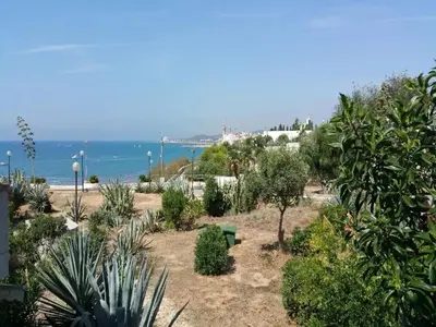 a garden with trees and plants on the beach at Comfortable House in Sitges with Shared Pool in Sitges