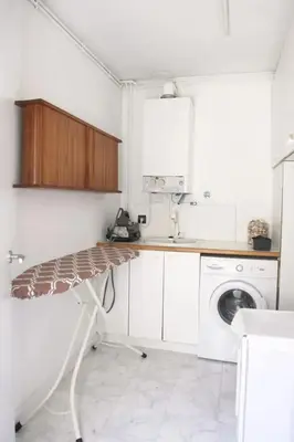 a white laundry room with a washer and dryer at Comfortable House in Sitges with Shared Pool in Sitges