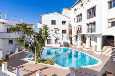 a swimming pool in the middle of a building at Sitges Blue - completamente reformado en 2025 in Sitges
