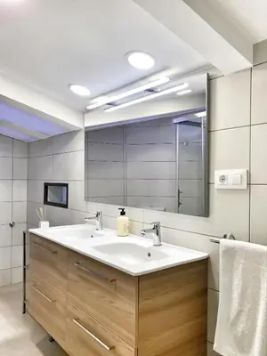 a bathroom with a sink and a mirror at Mon Residence Sant Jeroni in Manresa