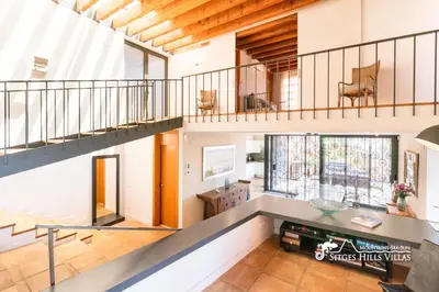 a swimming pool in the middle of a house at VILLA DUMAS with amazing sea views, AC and private pool in Sitges