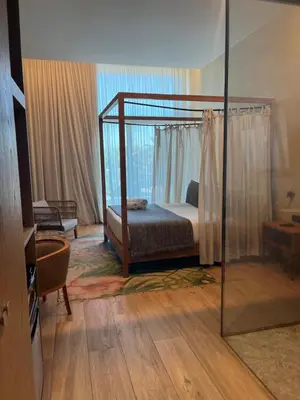 a bedroom with a canopy bed in a room at Playa Grande by Tropical in Gavà