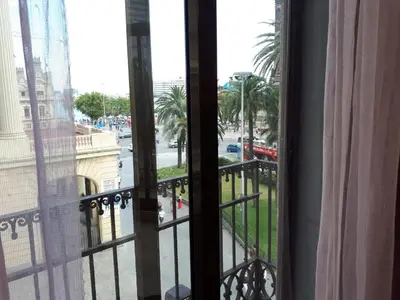 a view of a city street from a window at Beautiful Apartment on Las Ramblas with Port views in Barcelona
