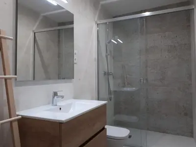 a bathroom with a sink and a shower and a toilet at Beautiful Apartment on Las Ramblas with Port views in Barcelona