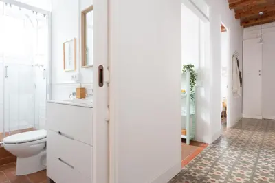 a bathroom with a toilet and a sink at Casa Cosi - Sant Gervasi 1 in Barcelona