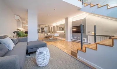 a living room with a couch and a table at Poble Nou II You Stylish Apartments in Barcelona