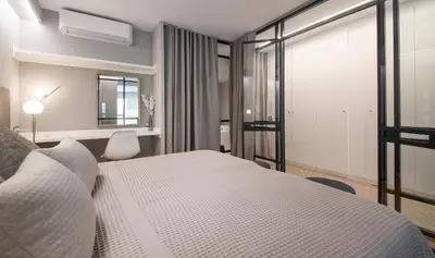 a bedroom with a white bed and a window at Poble Nou II You Stylish Apartments in Barcelona