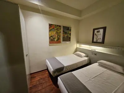 a room with two beds in a room at Hotel Annex - Rey Don Jaime I in Barcelona