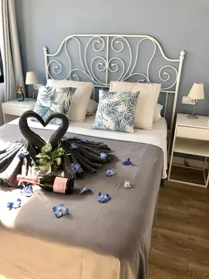 a bed with a heart made out of ribbons at Vilamarlux III in Vilassar de Mar